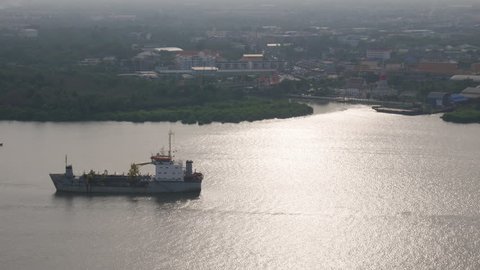 Aerial view of chemical transport tanker ship Passing in Chao Phraya river. Bangkok, Thailand