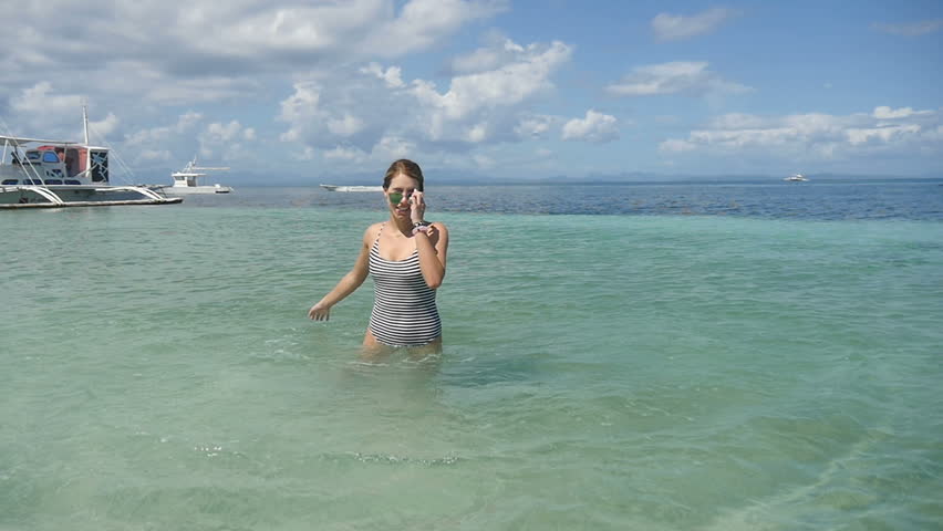 Beautiful Young attractive woman enjoying the lovely tropical ocean