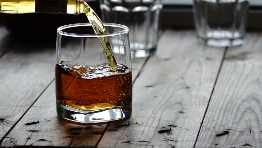 Whisky is poured into glass in slow motion | Shutterstock HD Video #33675799