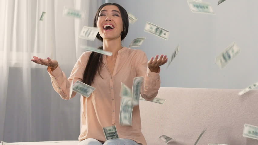 Lots of cash falling on happy surprised girl, favorable bank loan terms, money Royalty-Free Stock Footage #33677374