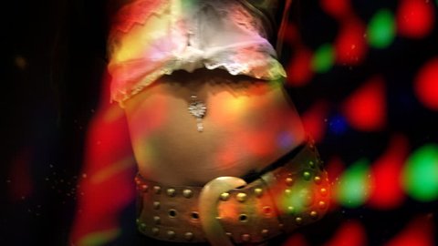 close-up of girls belly as she dances