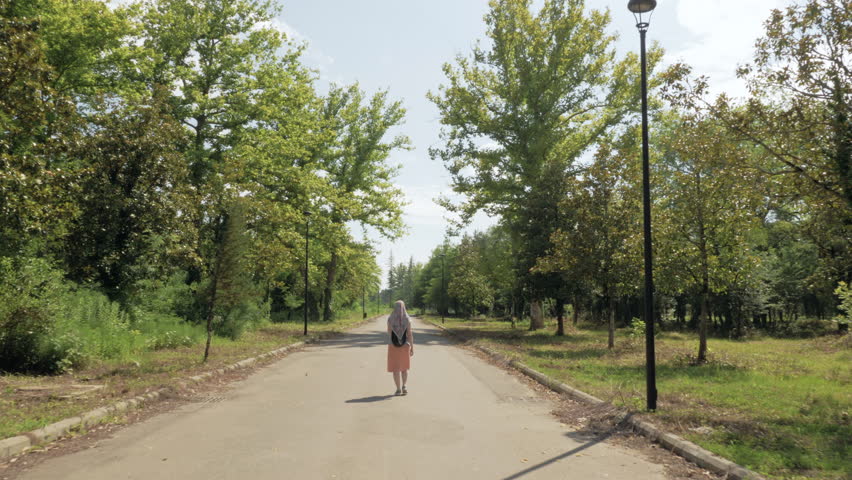 Woman walks in the park, Tskaltubo, Georgia