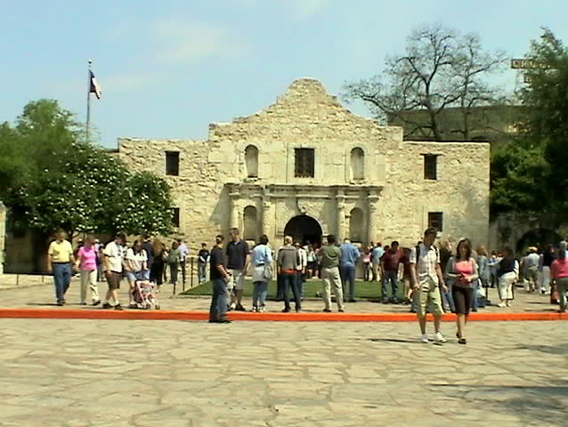 famous Alamo in san Antonio Texas. Vacation time and lots of tourists walking around. 