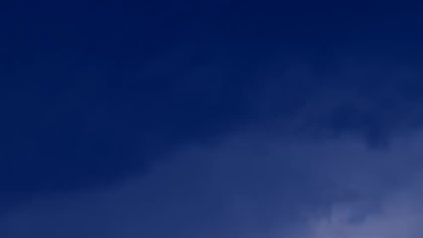 Amazing, unique stormy weather time lapse featuring sandstorm, lightning strike, swirling, fast-moving clouds, strong winds, sweeping rain shafts dumping monsoon rains on mountainous landscape. FHD.