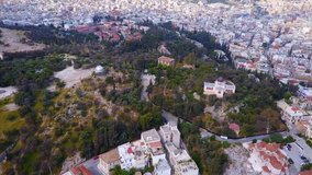Aerial bird's eye view video taken by drone of iconic old Athens Observatory, Athens historic center, Attica, Greece