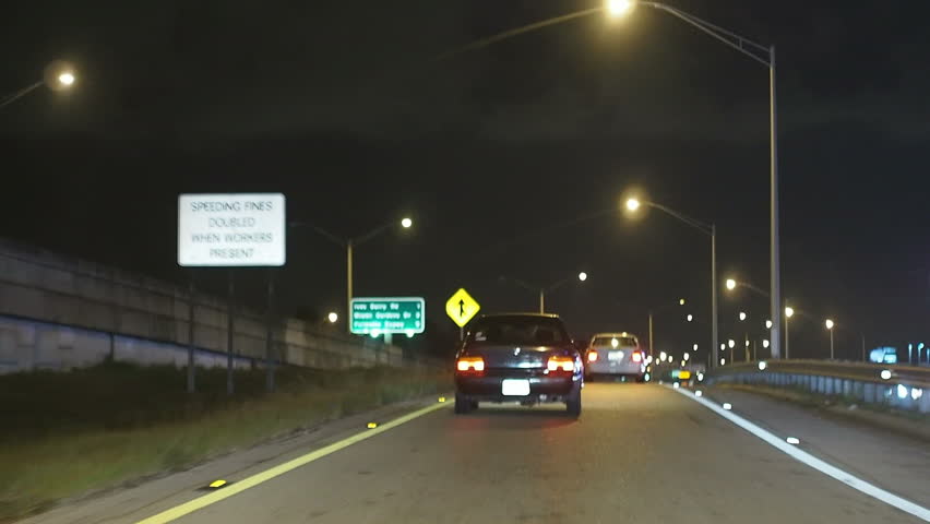 Vehicles traveling at night on highway