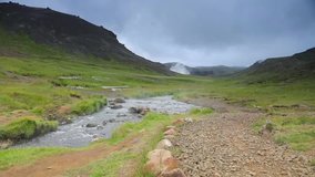 Picturesque landscape of a mountain river with traditional nature of Iceland. Slow Motion Footage.
