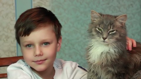 Boy playing with cat

