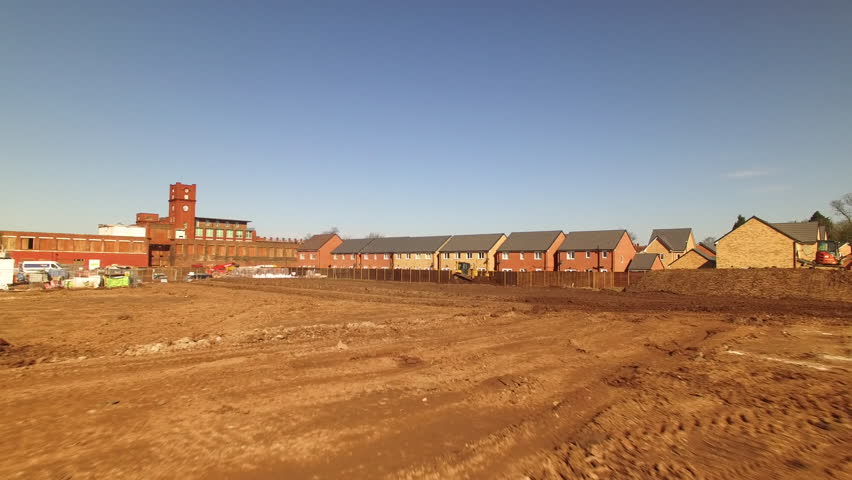An aerial drone shot in mid air as the shot establishes the constuction site.