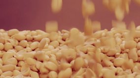 Purified peanuts are thrown up in beautiful slow motion
