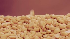 Purified peanuts are thrown up in beautiful slow motion