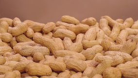 Peanuts fall on a soft surface in super slow motion