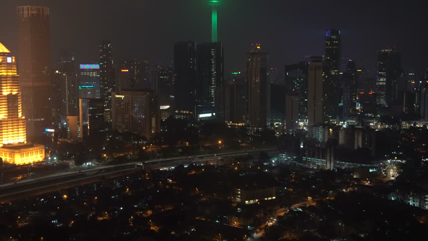Kuala Lumpur, Malaysia - November 25, 2017: 4k b-roll cinematic footage of night scene at Kuala Lumpur city skyline overlooking the famous Petronas Twin Towers KLCC and KL Tower, aerial view. 