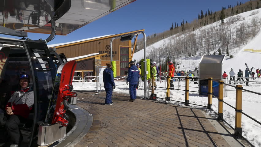 Park City, Utah, February 2017.  Family loads the Quicksilver Gondola that connects Park City Mountain Base and Canyons Village, Utah ski and snowboard resorts.  
