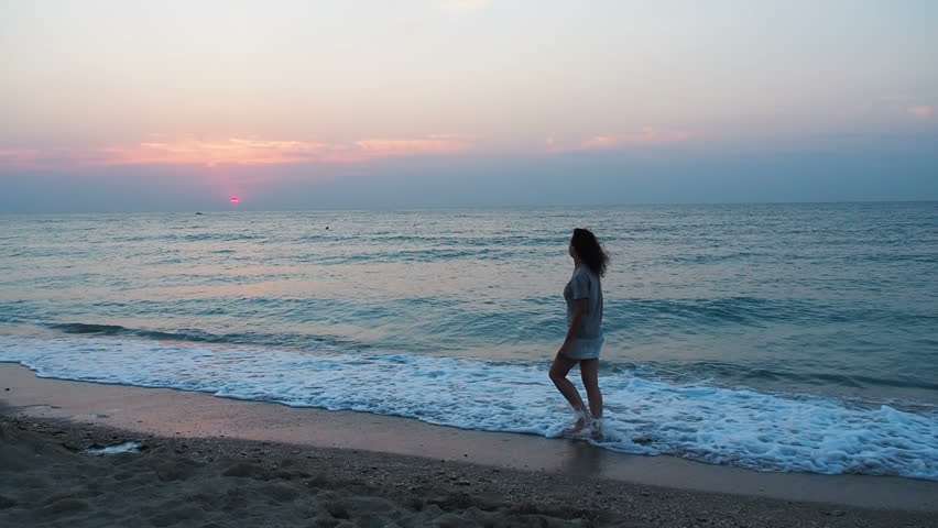 A Woman Is Walking Along Stock Footage Video 100 Royalty Free Shutterstock