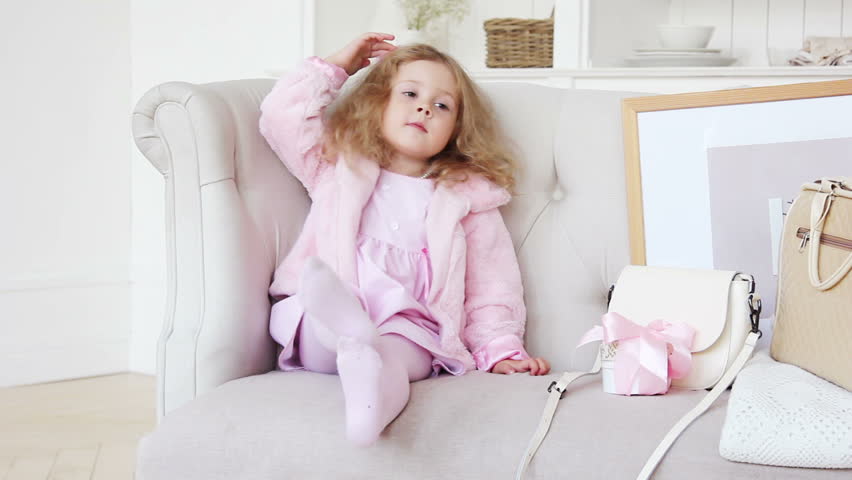 Adorable kid dressing up and styling