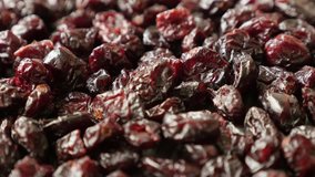 Dehydrated cranberries on pile slow tilt 4K 2160p 30fps UltraHD footage - Heap of red dried berries of Vaccinium oxycoccos 3840X2160 UHD tilting  video