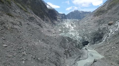 Aerial Drone moving slowly sideways over the Fox Glacier in New Zealand 4k