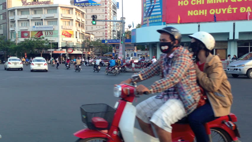 HO CHI MINH CITY - FEBRUARY 1: Panning view of scooter traffic in Ho Chi Minh