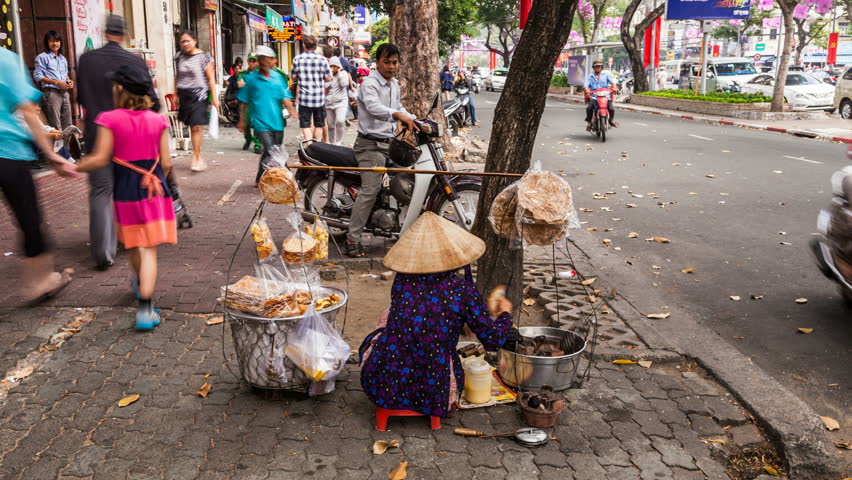 HO CHI MINH CITY, FEBRUARY 2: Timelapse view of a street vendor in the street of