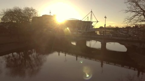Rising aerial view of Sunrise of the river in Cardiff, UK.