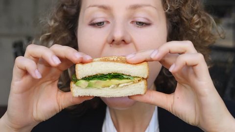 Closeup Of Hungry Girl Bites Off Veggie Avocado Sandwich. HD, 1920x1080. Slow Motion. 