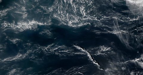 Very high-altitude overflight aerial of clouds over the Indian Ocean. Clip loops and is reversible. Elements of this image furnished by NASA