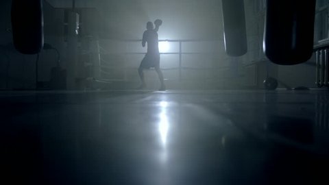 Man boxer training hard for a fight