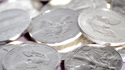 Spinning Silver Coins (macro video)