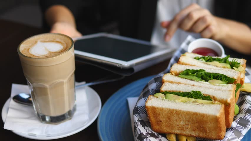 Closeup Of Hands Of Business Woman Using Tablet During Coffee Break. 4K.