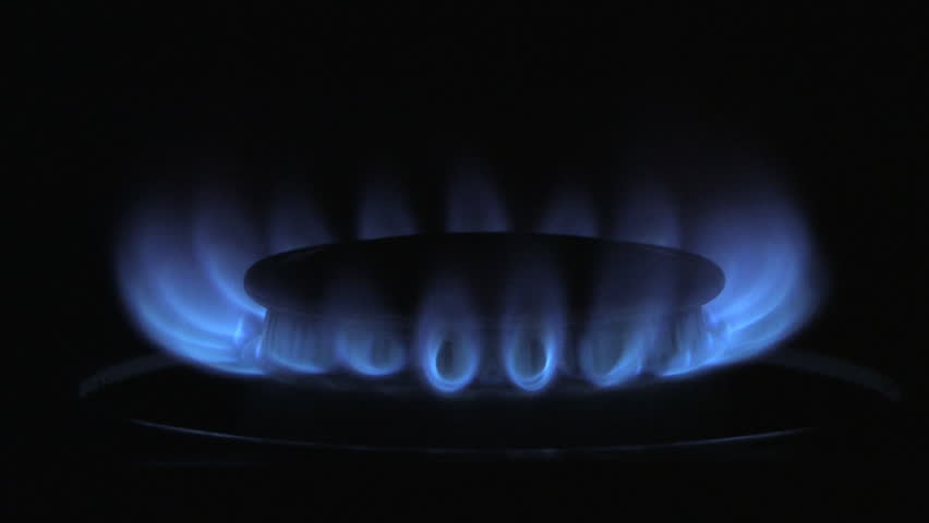 A gas burner ignites.