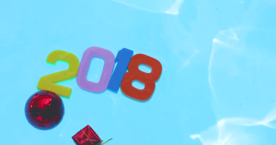 The 2018 movement, floating in a pool of blue water.