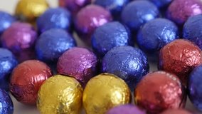 Close-up of colorful Christmas chocolate treats 3840X2160 UltraHD panning footage - Slow pan on assorted round candies 4K 2160p 30fps UHD video