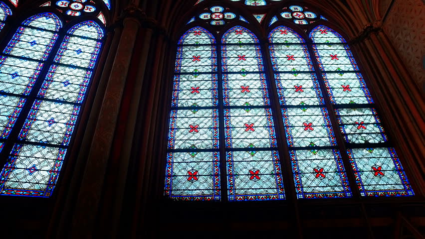 Stained glass windows inside the Notre Dame Cathedral, UNESCO World Heritage Site. Paris, France