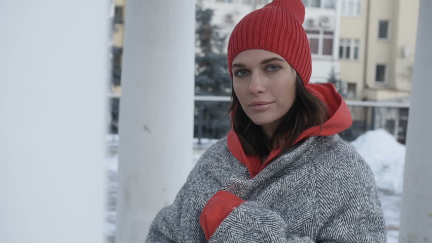 Pretty woman near high-rise buildings