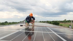 Engineer electrician asia check the installation of solar panels on metal roofs in industrial plants. Use a tape measure to measure the length of the solar panels and record the data on a tablet.
 - Powered by Shutterstock - Get 15% off with code: PIKWIZARD15