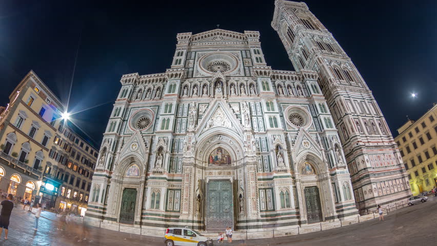 The front view of The Basilica di Santa Maria del Fiore night timelapse which is the cathedral church (Duomo) of Florence in Italy. Evening illumination. Bell tower and dome. Fisheye