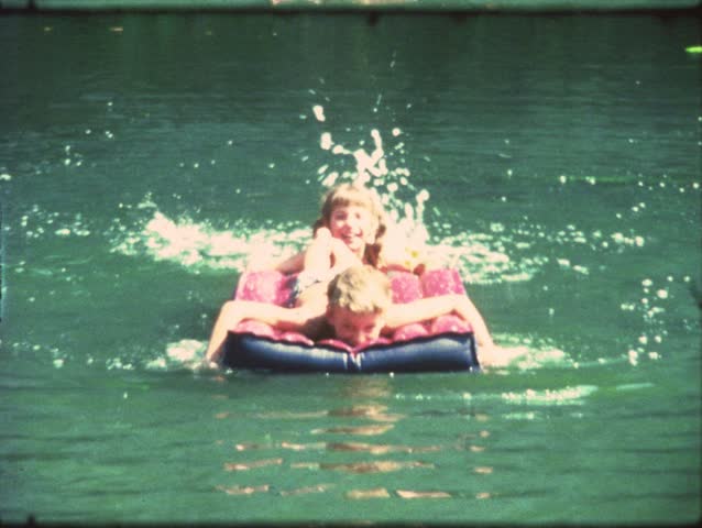Vintage 8 mm film: Children swimming in lake  | Shutterstock HD Video #3380363
