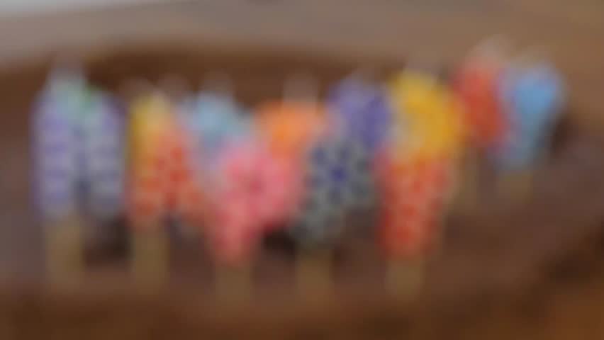 Happy Birthday candles on chocolate cake