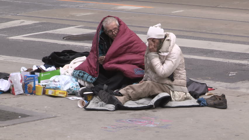 Toronto, Ontario, Canada December 2017 Desperate poor homeless couple livin...