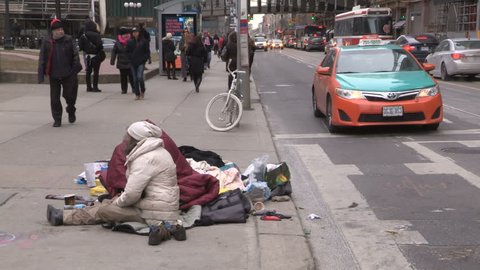 Toronto, Ontario, Canada December 2017 Desperate poor homeless couple living on the streets of Toronto