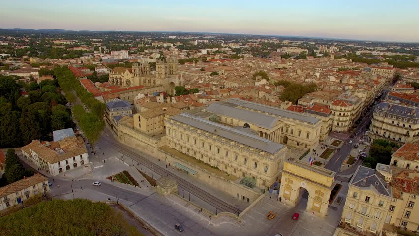Fast aerial of the Palais de Justice and the Porte du Peyrou moving sideways then backwards
