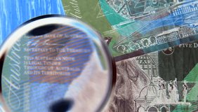 Details from Australian paper money. Extreme close up with magnifying glass. - Powered by Shutterstock - Get 15% off with code: PIKWIZARD15