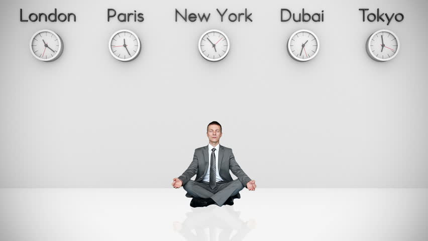Businessman Meditating with World Clocks on Background