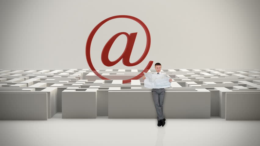 Businessman with Map trying to find his way in a Maze with Internet Mail Sign,