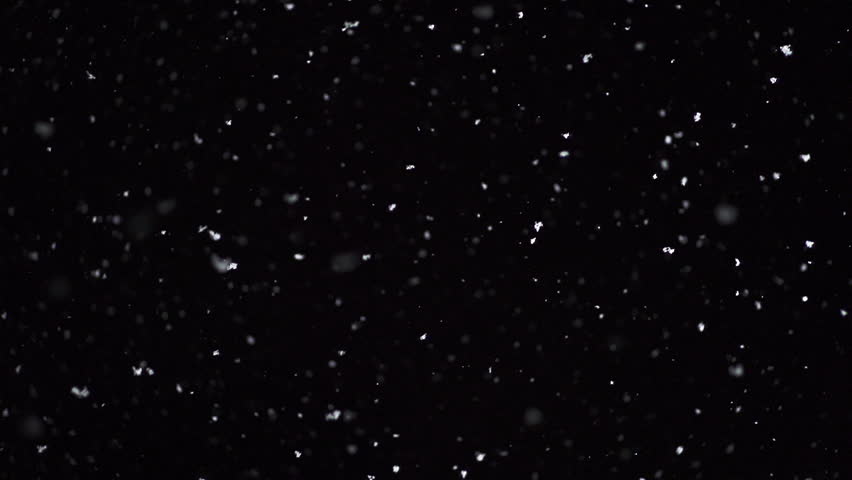 Winter snowfall. Snow Slow motion filmed at 250fps outdoors with studio lighting