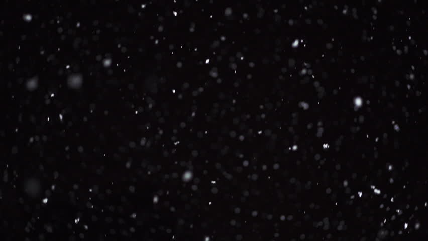 Winter snowfall. Snow Slow motion filmed at 250fps outdoors with studio lighting