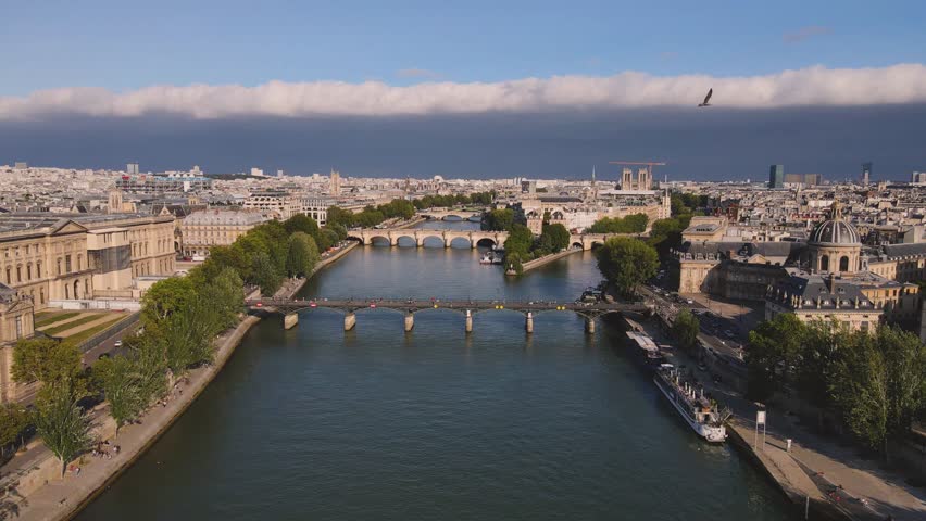 Notre Dame cathedral in Paris, aerial view of Seine river and traditional buildings in Paris, France