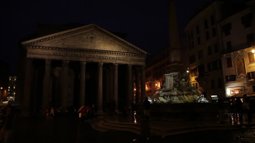 Pantheon Fountain glimmers in the dark shadowed Pantheon