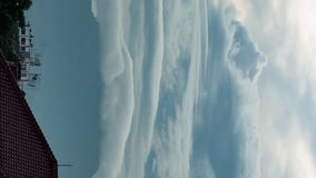 Vertical video - Timelapse of dramatic lenticular clouds hovering above the mountains - Powered by Shutterstock - Get 15% off with code: PIKWIZARD15